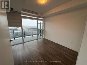 Vaughan (East Woodbridge) condo for rent - A room with a view of the city through large windows.