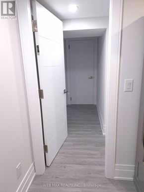 Toronto (Dorset Park) apartment for rent - A hallway with a closed door at the end.