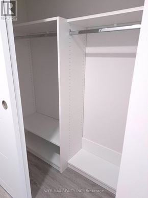 Toronto (Dorset Park) apartment for rent - A white closet with shelves and a hanging rod.