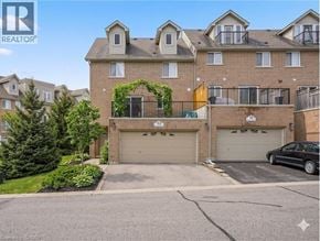 Cambridge townhouse for rent - A large brick apartment building with a black car parked in front of it.