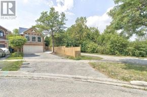 Brampton (Fletcher's West) apartment for rent - A residential area with a house, trees, and a gravel driveway.