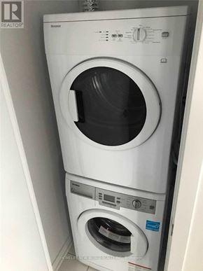 Toronto (Mount Pleasant West) condo for rent - A white washing machine with the door open.