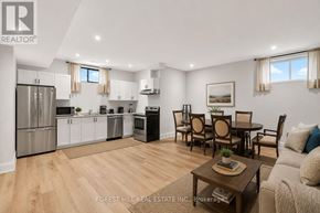 Toronto (Englemount-Lawrence) apartment for rent - A well-lit kitchen and dining area with wooden flooring and modern appliances.