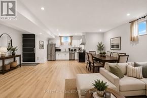 Toronto (Englemount-Lawrence) apartment for rent - A well-lit, spacious living room with a dining area and kitchen in the background.