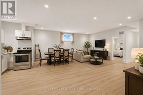 Toronto (Englemount-Lawrence) apartment for rent - A modern living room with a dining table and chairs.