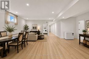 Toronto (Englemount-Lawrence) apartment for rent - A spacious living room with a dining table and chairs.