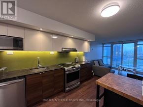 Toronto (Bayview Village) condo for rent - A kitchen with a dishwasher, sink, stove, and oven.
