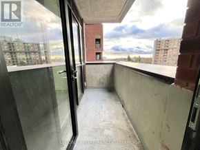 Toronto (Cliffcrest) condo for rent - A balcony with a glass door leading to a cityscape.