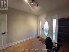 Toronto (East York) apartment for rent - A room with a door and a window with a white frame.