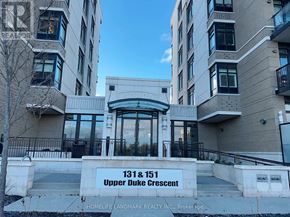 Markham (Unionville) condo for rent - The image shows the front view of a building with the sign "131 & 151 Upper Duke Crescent" and the logo of "HOMELIFE LANDMARK REALTY INC."