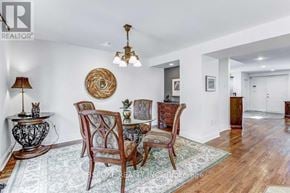 Toronto (Kingsway South) apartment for rent - A dining room with a wooden table and chairs.