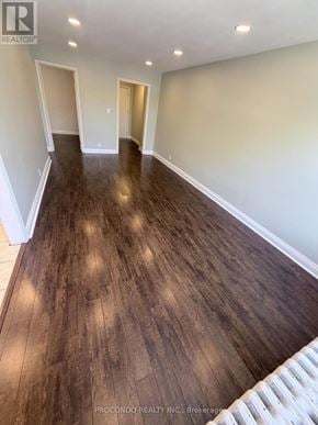 Mississauga (Port Credit) multi-family for rent - A room with wooden flooring and white walls.