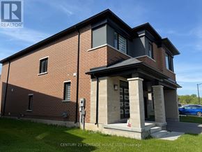 Brampton (Northwest Brampton) apartment for rent - A brick building with a sign that says Century 21 Heritage House Ltd Brokage.