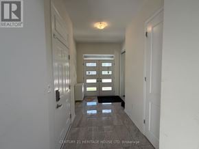 Brampton (Northwest Brampton) apartment for rent - A hallway with a tiled floor and white walls.