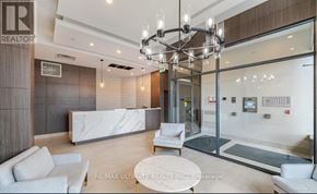 Grimsby (Grimsby Beach) condo for rent - A modern office lobby with a white reception desk and a glass wall.