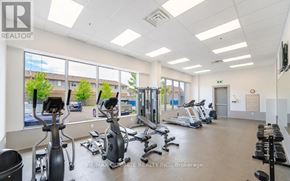 Grimsby (Grimsby Beach) condo for rent - A gym with exercise equipment and a large window.