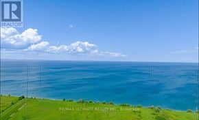 Grimsby (Grimsby Beach) condo for rent - A real estate company logo is displayed on a scenic coastal background.