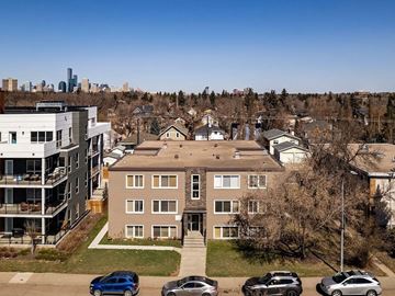 Edmonton apartment for rent - A residential area with houses and cars parked on the street.