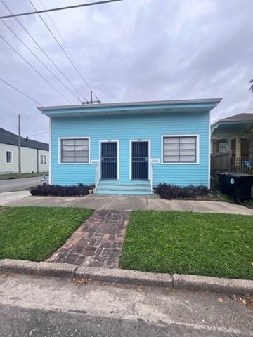 New Orleans apartment for rent - A blue house with a black door and windows.