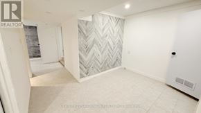 Richmond Hill (Crosby) apartment for rent - A room with a chevron patterned wallpaper and a rug on the floor.