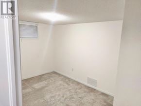 Barrie (Painswick South) apartment for rent - A room with a tiled floor and a window with blinds.