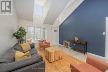 Halton Hills (Georgetown) apartment for rent - A living room with a grey couch and a wooden coffee table.