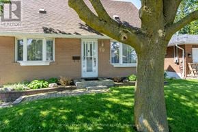 Halton Hills (Georgetown) apartment for rent - A house with a tree in front of it.