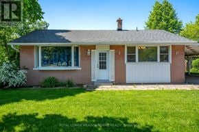 Halton Hills (Georgetown) apartment for rent - A house with a white door and windows is for sale.