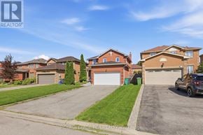 Caledon (Bolton East) apartment for rent - A residential area with houses and a car parked in front of one.