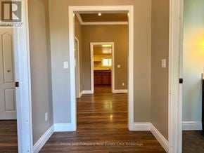 St. Marys apartment for rent - A hallway with a door on the left and a doorway in the distance.