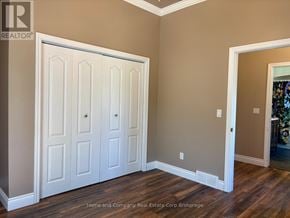 St. Marys apartment for rent - A room with a white door and wooden flooring.