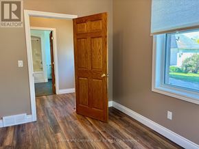 St. Marys apartment for rent - A wooden door is in a room with a window.