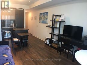Toronto (Waterfront Communities) condo for rent - A living room with a TV, a couch, and a dining table.