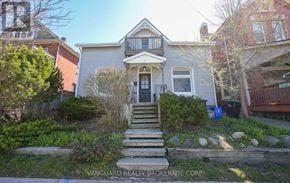 Barrie (Codrington) duplex for rent - A house with a front yard and a porch.