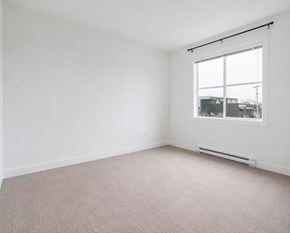 Langley apartment for rent - Empty room with a window and a carpeted floor.