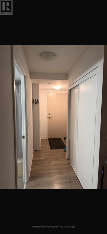 Toronto (Woburn) condo for rent - A long hallway with a door at the end.
