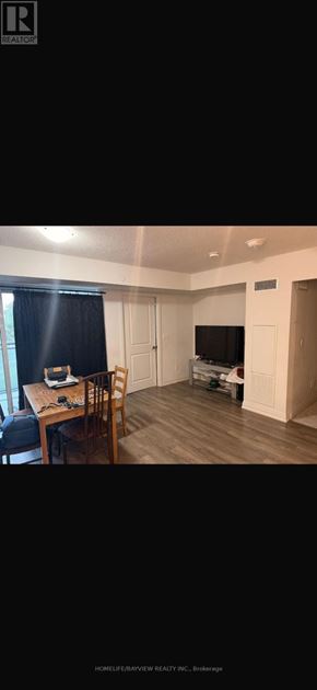 Toronto (Woburn) condo for rent - A room with a dining table and chairs is shown.