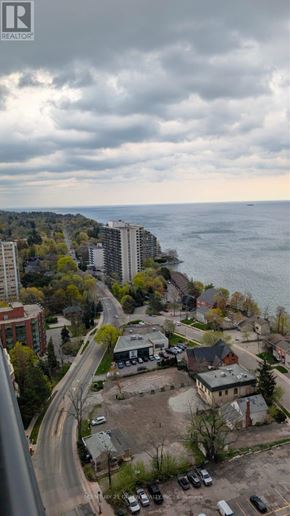 Burlington (Brant) condo for rent - A view of a city with a body of water in the background.