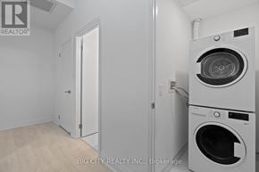 Toronto (Thorncliffe Park) condo for rent - A white washer and dryer in a laundry room.