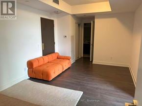 Markham (Unionville) condo for rent - A living room with a couch and a rug.