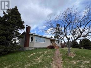 Richards Landing apartment for rent - A house with a red roof and a tree in front of it.