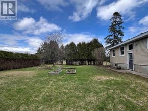 Richards Landing apartment for rent - A backyard with a fence and a house.