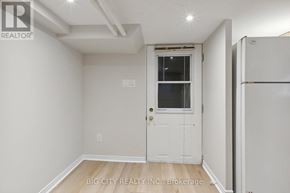 Toronto (Lawrence Park North) apartment for rent - A white door with a window is in a room with white walls.