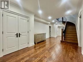 Toronto (Willowdale East) apartment for rent - A spacious room with wooden floors and a staircase.