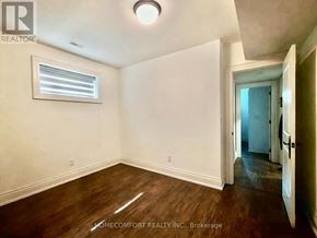 Toronto (Willowdale East) apartment for rent - A room with a window and wooden floors is on the market with Homecomfort Realty Inc.