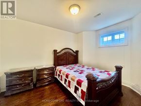 Toronto (Willowdale East) apartment for rent - A bedroom with a bed, dressers, and a window.