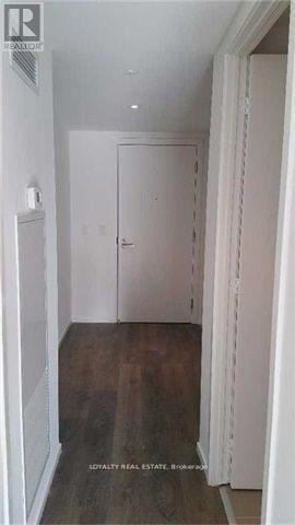 Toronto (Church-Yonge Corridor) condo for rent - A hallway with a door and a sign on the wall.