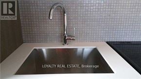 Toronto (Church-Yonge Corridor) condo for rent - A sink in a bathroom with a brokerage logo on the wall.