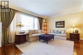 Toronto (Willowdale West) apartment for rent - A living room with a couch, a coffee table, and a lamp.