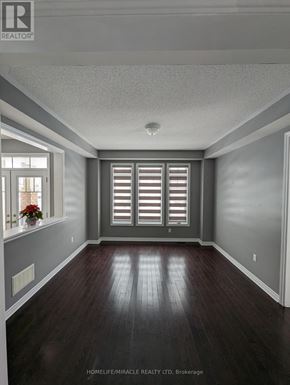 Collingwood apartment for rent - A room with wooden floors and a window with shutters.